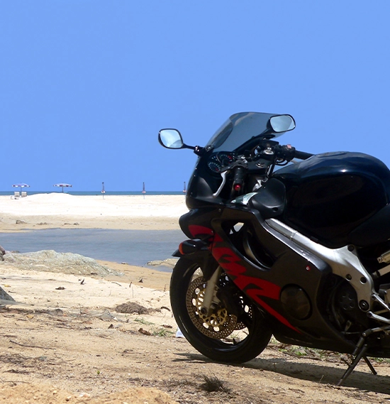 Motorcycle standing near the coast