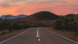 Winding open road at sunset with the hills in the distance on the New England Highway in NSW